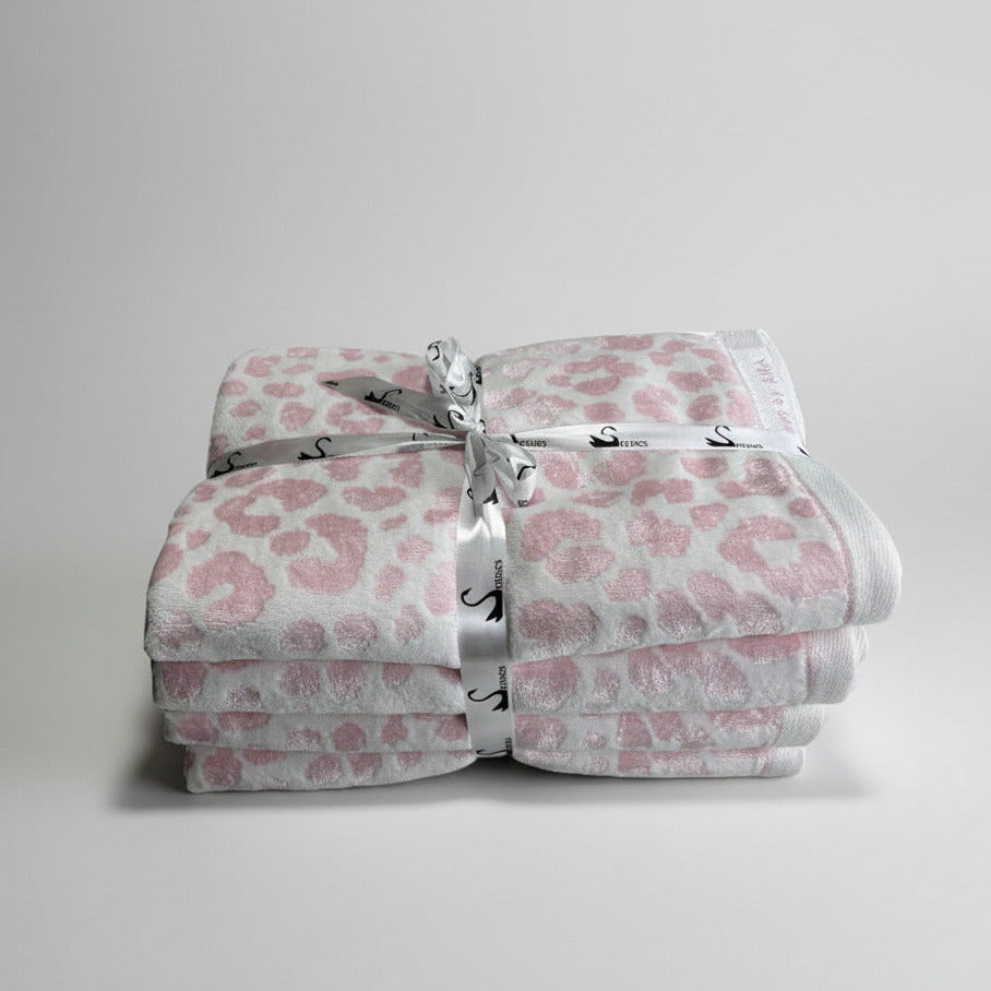 Jacquard towels. white and pink colour. leopard pattern 