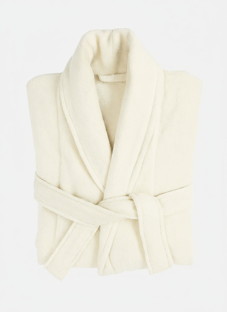 Folded cream-colored robe on a white background